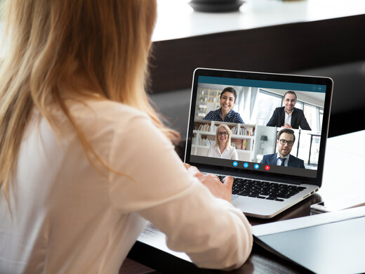 Back,View,Of,Businesswoman,Speak,Using,Webcam,Conference,On,Laptop